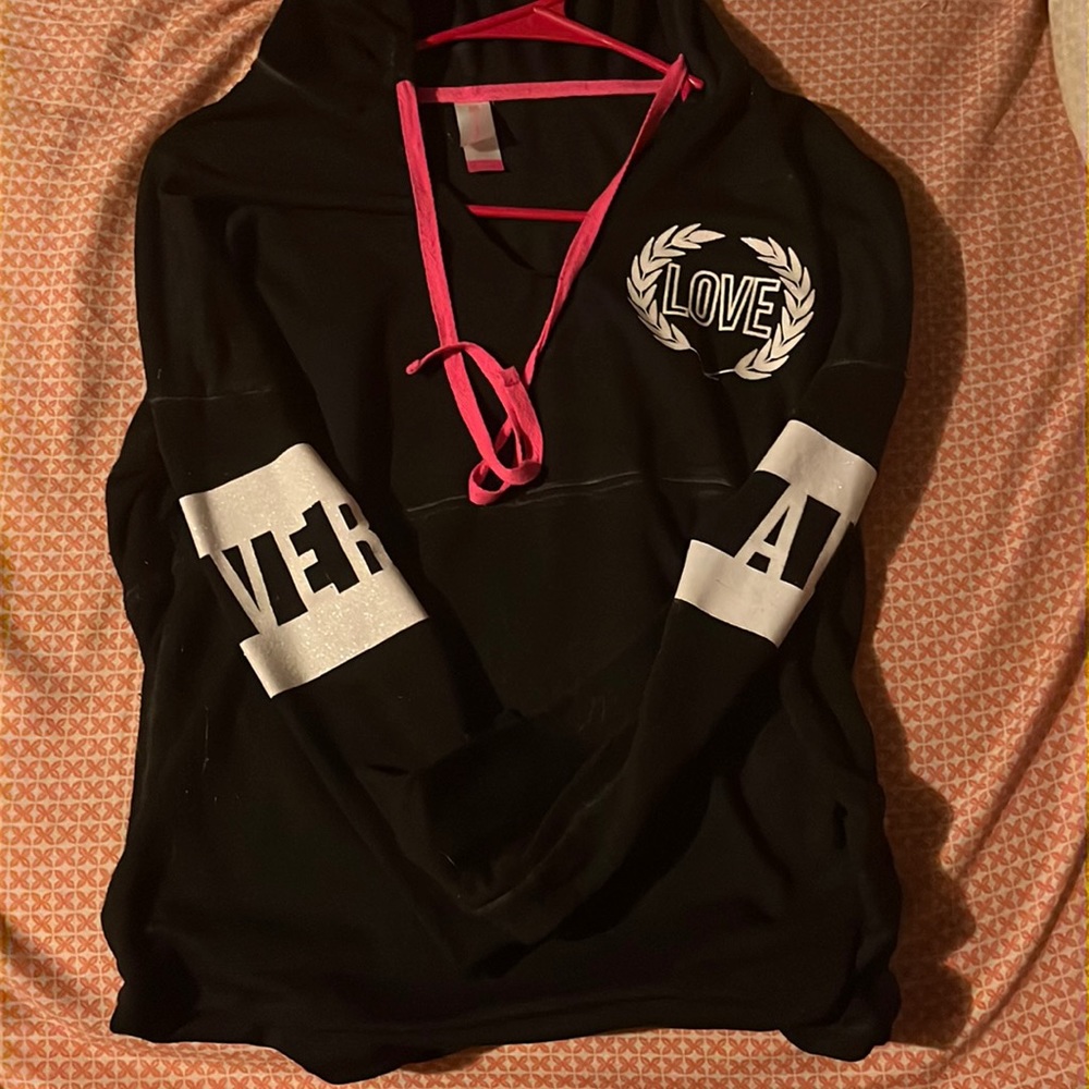 Size small. black with pink and white.